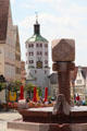 Modern fountain & Kueturm viewed from market square. Günzburg, Germany.