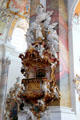Baroque pulpit overlooked by sunburst & Holy Spirit at Ottobeuren Abbey. Ottobeuren, Germany.