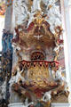 Detail of baroque pulpit overlooked by sunburst & Holy Spirit at Ottobeuren Abbey. Ottobeuren, Germany.