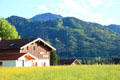 Farm building in alpine setting in Chiemsee region. Chiemsee, Germany