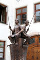 Brotbrunnen dedicated to bread making with figures of bakery workers on Schrannengasse in town center. Füssen, Germany.