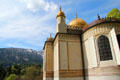 Elaborate exterior of Moorish Kiosk with Ammergau Alps in the background at Linderhof Castle. Ettal, Germany.