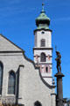 St Stephan's Church tower & statue of Neptune with trident & dolphin. Lindau im Bodensee, Germany.