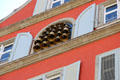 Cluster of musical bells on building facade. Lindau im Bodensee, Germany.