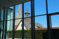 View of Ulm Cathedral spires through windows of Kunsthalle Weishaupt. Ulm, Germany