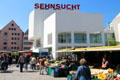 Shoppers & modern building in Market Area. Ulm, Germany.