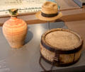 Ceramic water jug, straw hat & wooden water canteen from Romania at Danube Schwabian Museum. Ulm, Germany.