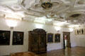 Gallery with coffered ceiling showing painting & antique furniture at Ulmer Museum. Ulm, Germany.