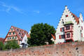 Step-gabled buildings above brick city wall. Ulm, Germany.