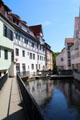 Germanic style residences reflected in Blau River. Ulm, Germany.