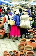 Women in traditional dress in the market of Cuenca. Ecuador.