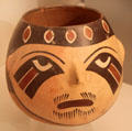 Nazca culture ceramic global vessel face with eye in the shape of a bird's head from Peru at Museum of America. Madrid, Spain.