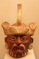 Moche ceramic stirrup-spout bottle portrait head of distinguished hat & mustache from Peru at Museum of America. Madrid, Spain.