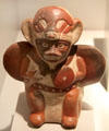 Moche ceramic stirrup-spout bottle with figure of warrior from Peru at Museum of America. Madrid, Spain.