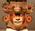Moche ceramic vessel head with face painting & jaguar headdress from Peru at Museum of America. Madrid, Spain.