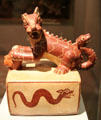 Moche ceramic vessel in shape of feline with snake tail from Peru at Museum of America. Madrid, Spain.