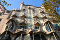 Colored tile decorates facade of Gaudi's Casa Batlló. Barcelona, Spain.