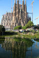 Sagrada Familia over pond of Plaza. Barcelona, Spain.