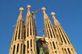 Four Apostle towers with figure of Christ ascending on Passion facade of Sagrada Familia. Barcelona, Spain.