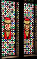 Stained glass window with EG initials over stairs on main floor at Palau Güell. Barcelona, Spain.