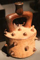 Ceramic stirrup-handle vessel from Chavin Culture, Peru at Barbier Mueller Precolumbian Art Museum. Barcelona, Spain.