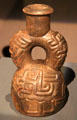 Ceramic stirrup-handle vessel from Cupisnique Culture, Peru at Barbier Mueller Precolumbian Art Museum. Barcelona, Spain.