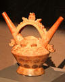 Ceramic double-spouted bridge-handle vessel from Lambayeque Culture, Peru at Barbier Mueller Precolumbian Art Museum. Barcelona, Spain.
