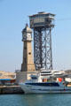 Barcelona port clock tower & Torre d'Alta Mar Telefèric terminal. Barcelona, Spain.