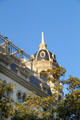 Dome of heritage building on Avinguda Diagonal with oval windows. Barcelona, Spain.