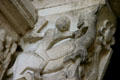 Detail of man fighting mythical animal to left of tympanum of Cathedral St. Lazarre. Autun, France.