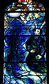 Detail of kneeling man from stained-glass by Marc Chagall in Cathedral. Metz, France.