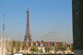 Eiffel Tower plus flag poles & wire globe seen from UNESCO Headquarters. Paris, France.