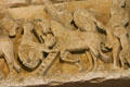 Narthex tympanum detail of dwarves climbing onto a horse at Basilique Ste-Madeleine. Vézelay, France.