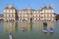 Luxembourg Palace over model sailboats on great basin of Luxembourg Gardens. Paris, France
