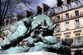 Rhinoceros Attacked by a Tiger bronze sculpture by Auguste Nicolas Cain in Tuileries Garden. Paris, France.