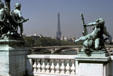 Statues of Alexandre III bridge plus Eiffel Tower. Paris, France.