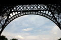 Artistry of lower arch of Eiffel Tower. Paris, France.