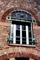 Courtyard facade window arch detail at Castel Béranger Hector Guimard. Paris, France.