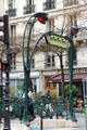 Details of Metropolitain sign & flower lights of Paris Metro entrance. Paris, France.