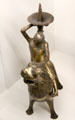 Bronze candle stick as woman riding lion from Meuse Valley at Museum of Decorative Arts. Paris, France.