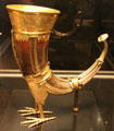 Gilded copper drinking horn in form called claw of griffon from Germany at Cluny Museum. Paris, France