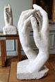 Sculpted hands: stone The Cathedral & marble The Secret by Auguste Rodin at Rodin Museum. Paris, France