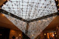Inverted pyramid projecting into shopping mall at Louvre Museum. Paris, France