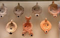 Collection of Roman oil lamps at Louvre Museum. Paris, France.