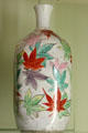 Japanese ceramic bottle painted with maple leaves from Kyoto at Sèvres National Ceramic Museum. Paris, France.