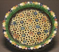 Bowl with flower decoration, Palissy imitation of Corplet at Arts et Metiers Museum. Paris, France.