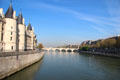 Conciergerie towers along the bank of Seine River. Paris, France.