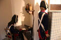 Reproduction of guards room separated from Marie-Antoinette's cell by a screen at Conciergerie. Paris, France.