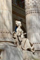 Seated figure sculpted on Grand Palais. Paris, France.