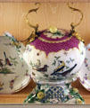 Meissen porcelain teapot on stand with birds at Nissim de Camondo Museum. Paris, France.